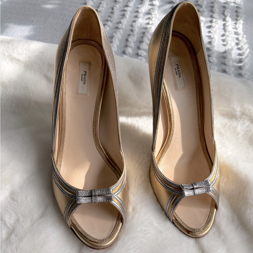 PRADA silver and gold peep toe pumps with a 5” heels with crystals.